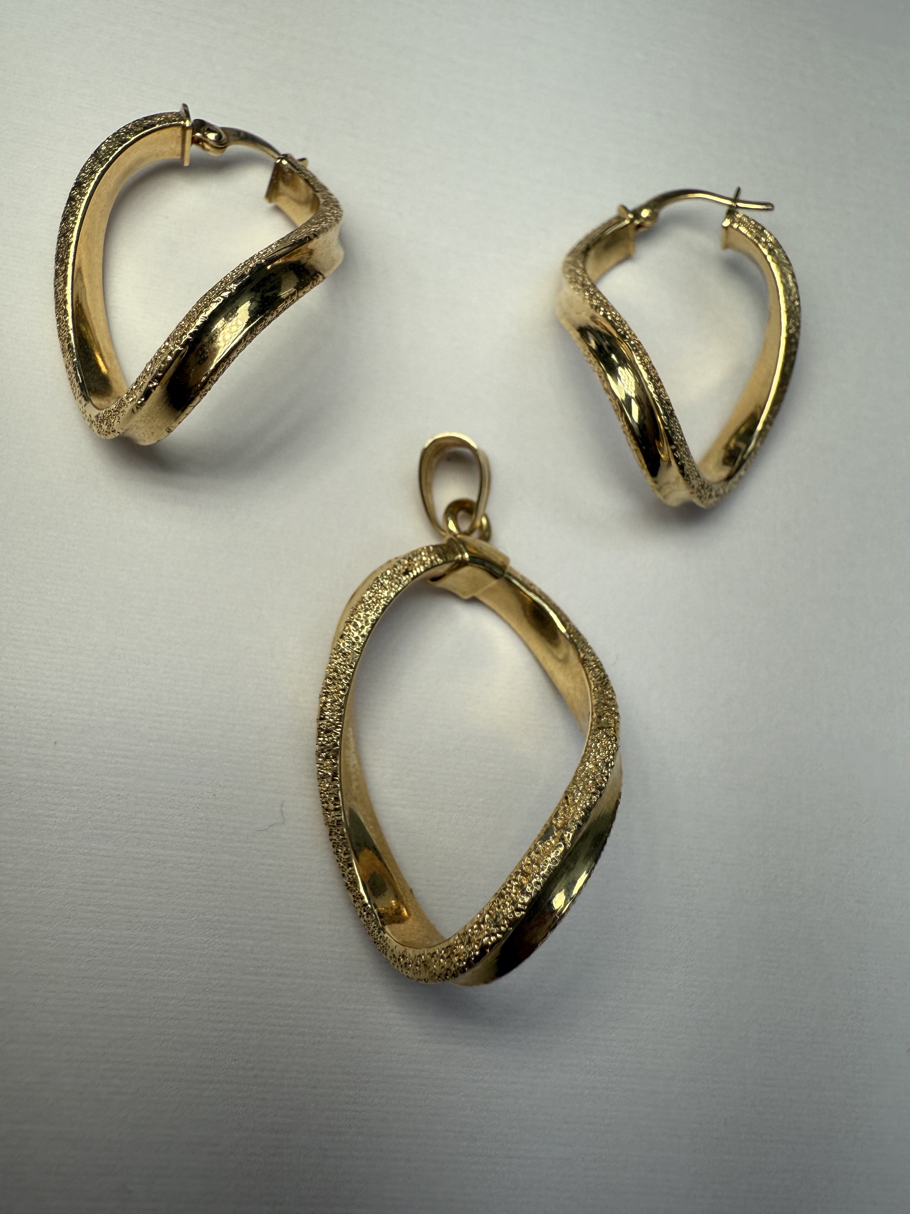 Shiny Curvy Gold Earrings and Pendant Set (necklace sold separate)